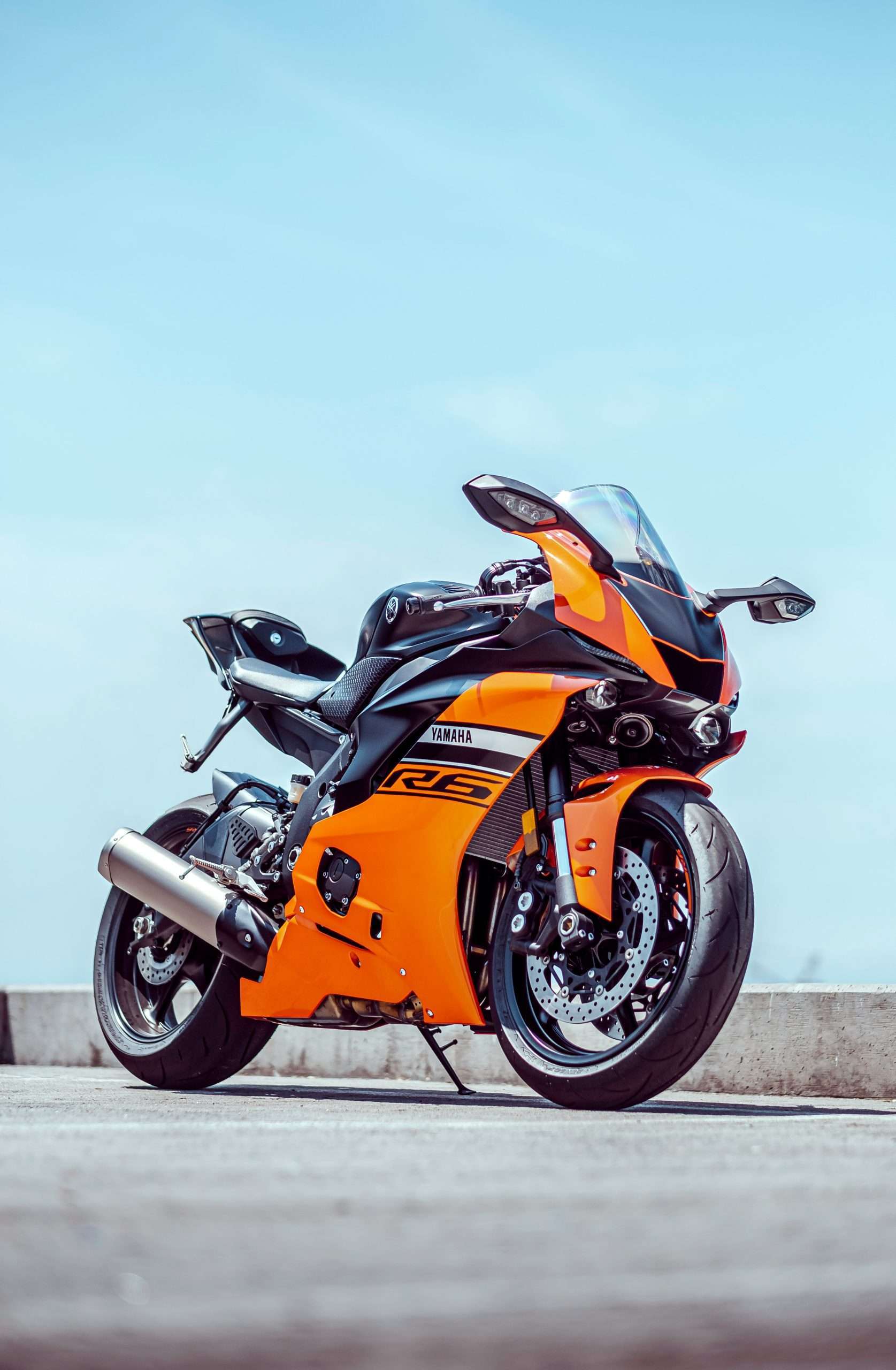 Motorcycle Trackers: 7 Essential Checks for Better Security 7 Orange sports motorcycle shown from a low angle