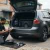 Car subwoofers being checked in the boot of a modern UK vehicle