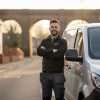 Installer beside a modern white van discussing van security tracking